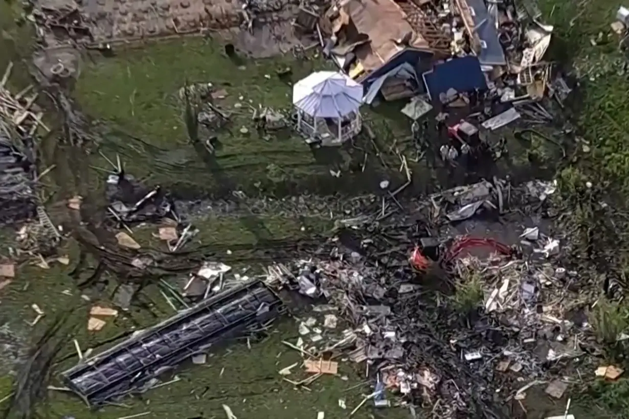 Wreckage is strewn across a property the day after a deadly series of tornados in Texas