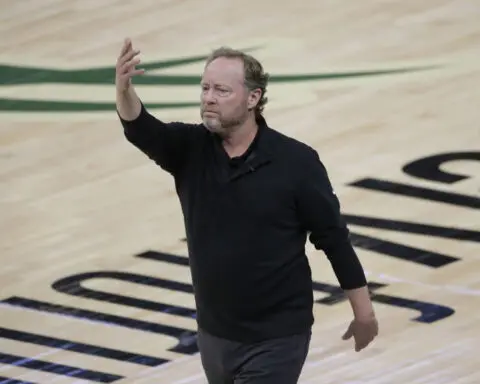 Mike Budenholzer is hired as coach of the Phoenix Suns, replacing Frank Vogel