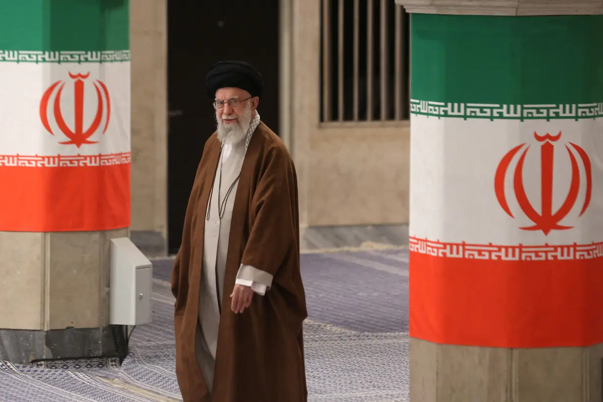 Iran's Supreme Leader Ayatollah Ali Khamenei votes during runoff parliamentary election, in Tehran