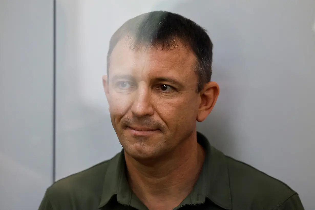 Major General Ivan Popov, arrested on suspicion of fraud, attends a hearing at the military court in Moscow