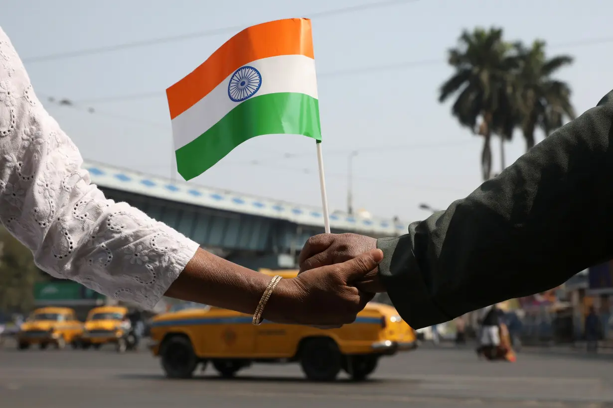 Demonstrators form a human chain after Republic Day celebrations to protest against a new citizenship law in Kolkata