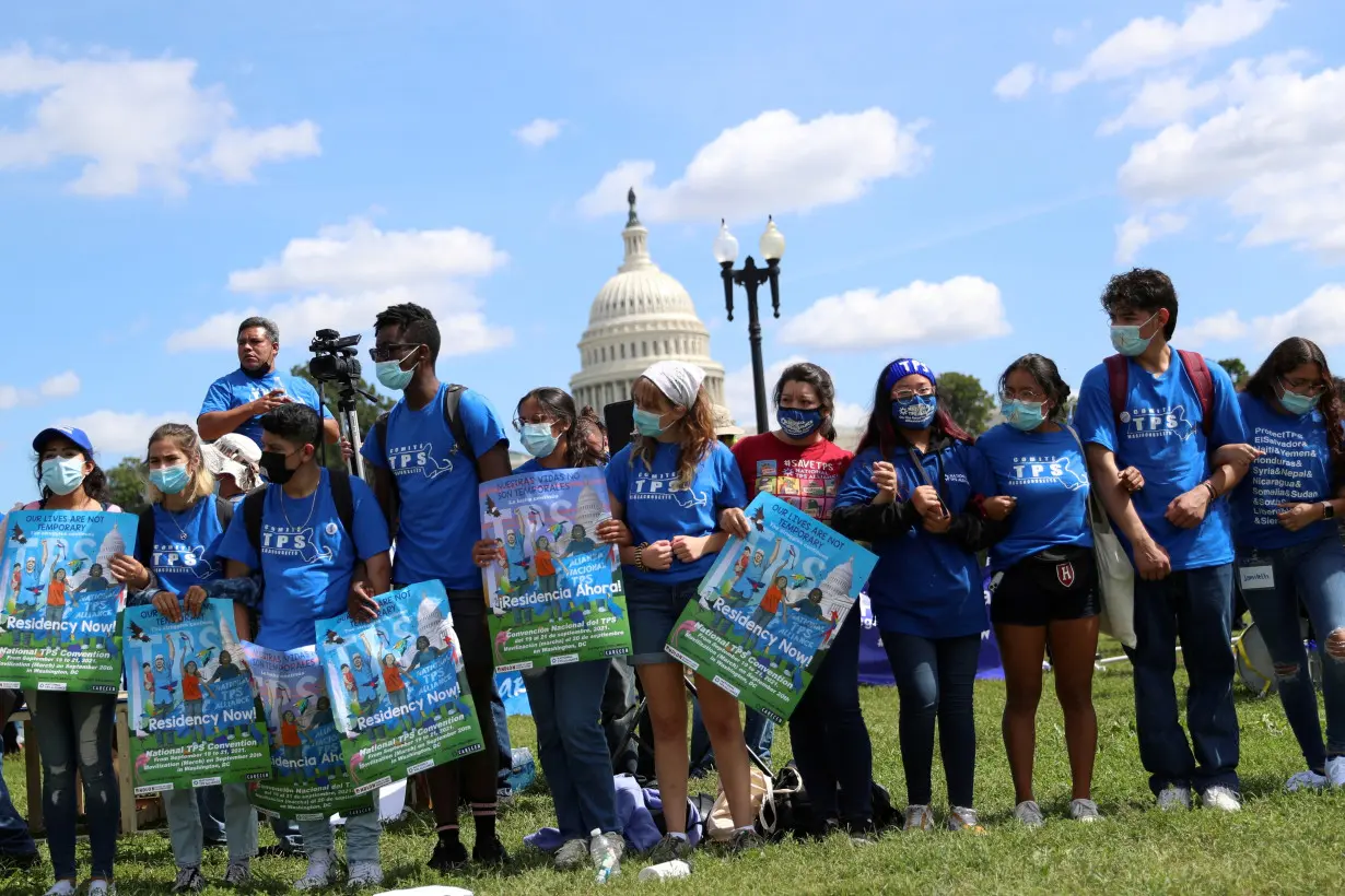 FILE PHOTO: Demonstrators march at the U.S. Capitol calling for a pathway to citizenship, in Washington