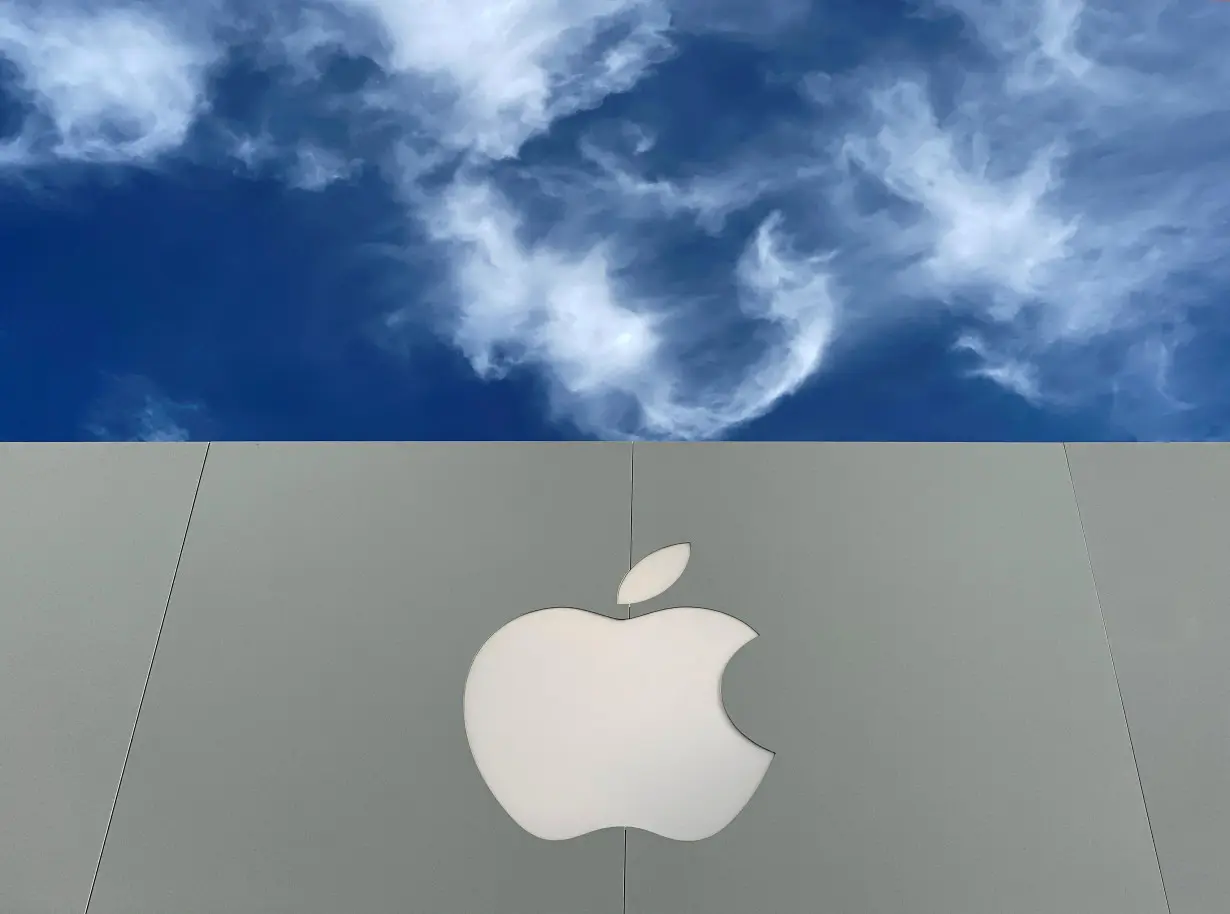 FILE PHOTO: FILE PHOTO: The Apple logo is shown atop an Apple store at a shopping mall in La Jolla, California