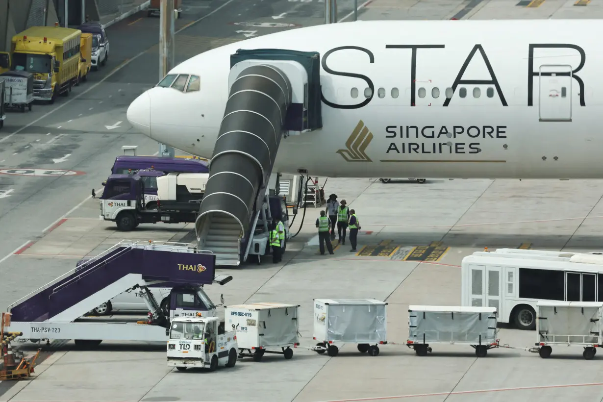 Singapore Airlines aircraft for flight SQ321 is parked on the tarmac after an emergency landing at Suvarnabhumi International Airport