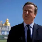 Britain's Cameron, in Kyiv, promises Ukraine aid for 'as long as it takes'