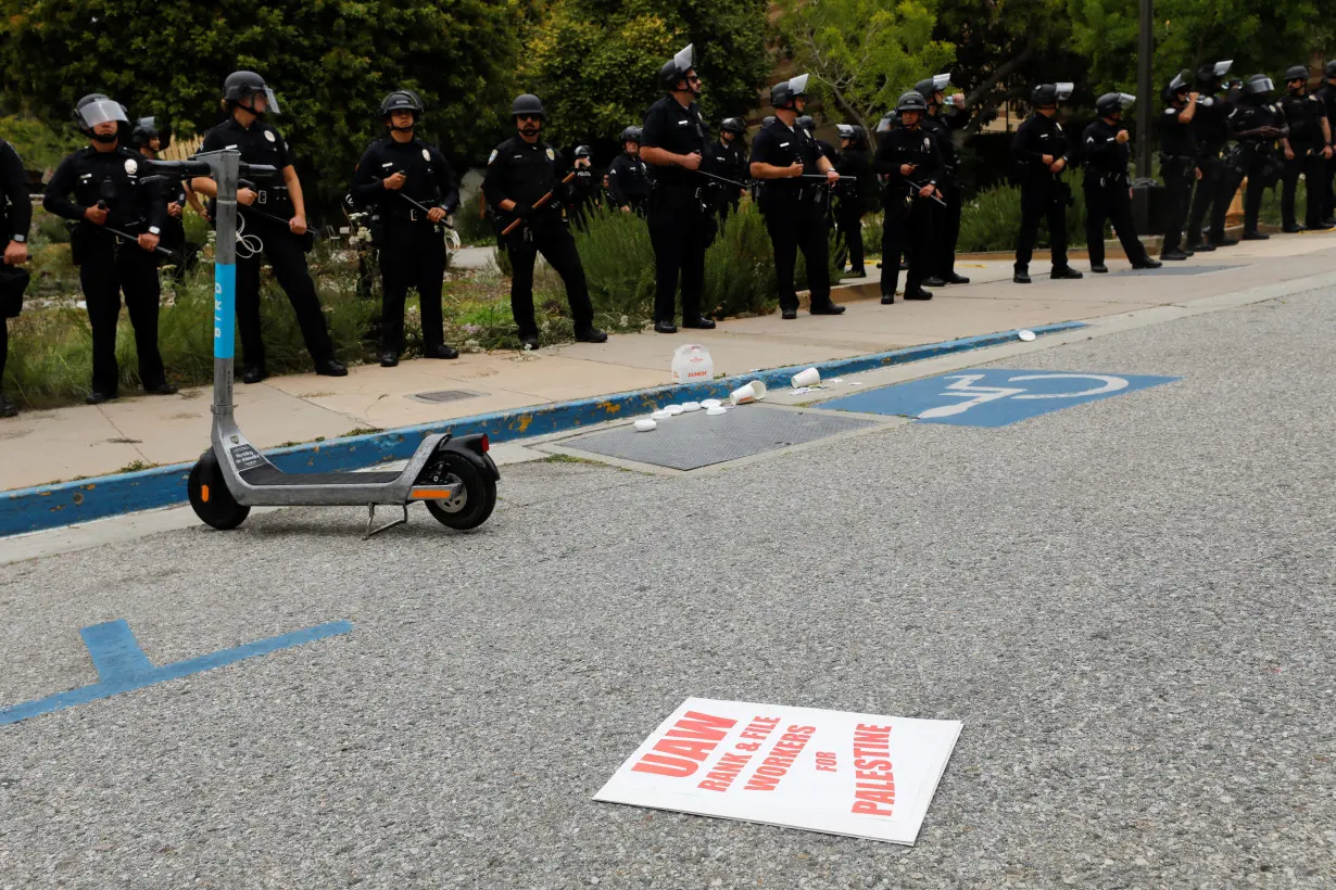 Police officers stand guard at the University of California, Los Angeles (UCLA)