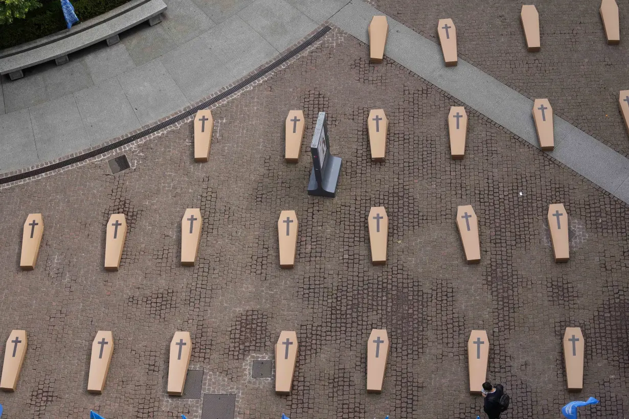 LA Post: Mock coffins fill a square in Milan in a protest over workplace safety in Italy