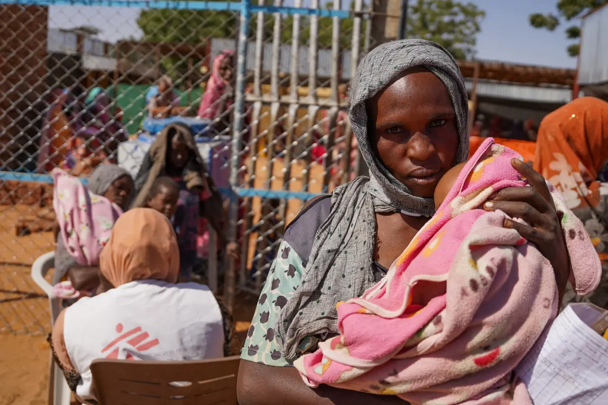 FILE PHOTO: Handout photograph of a woman and baby at the Zamzam displacement camp in North Darfur