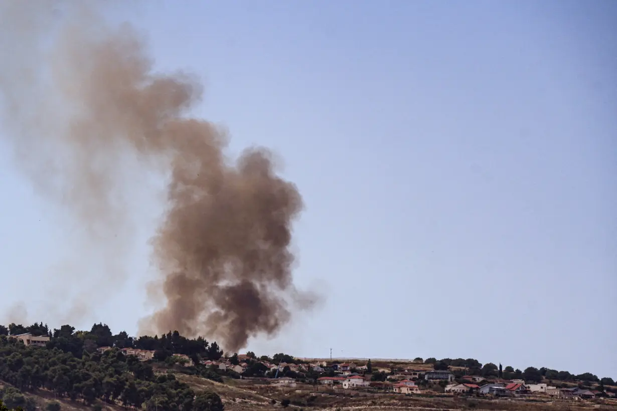 FILE PHOTO: Smoke rises on the Israeli side of its border with Lebanon following a rocket that was launched from Lebanon and fired towards Israel