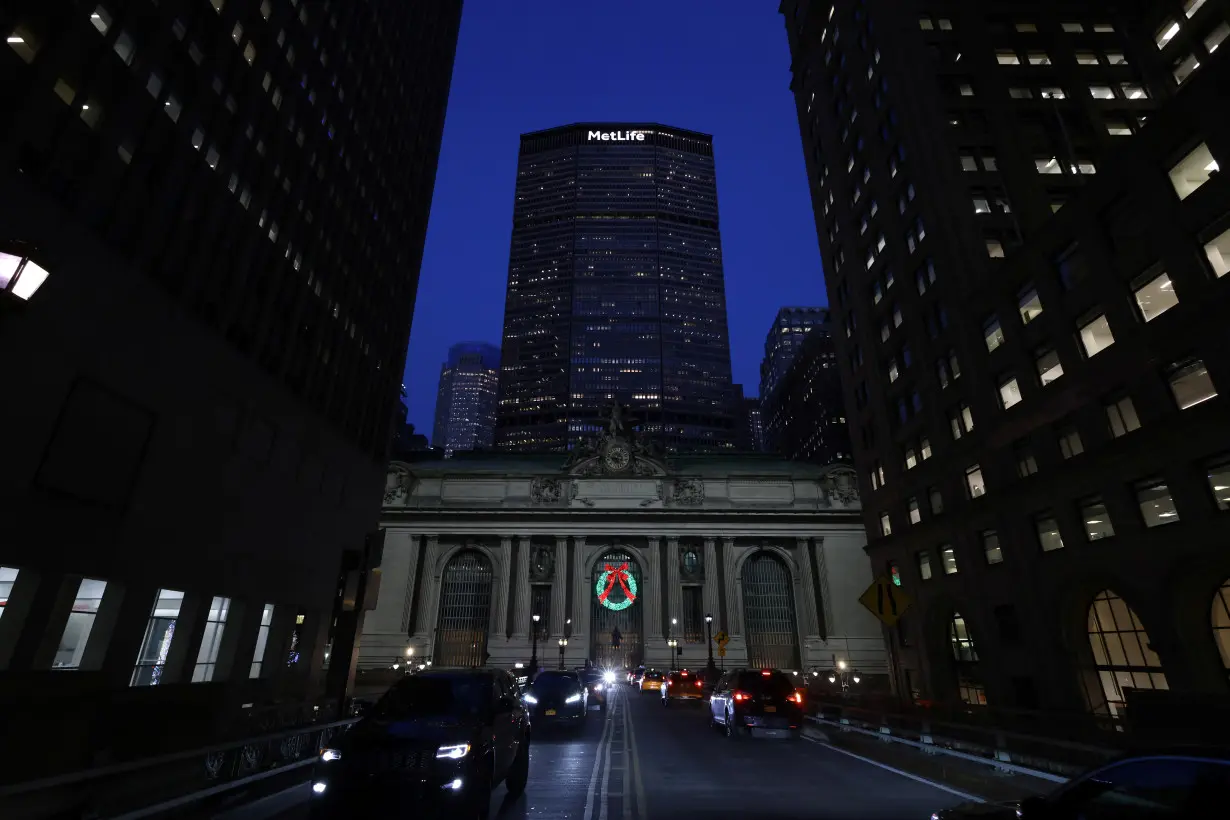 Vehicles drive in front of the MetLife Inc. building in Manhattan, New Yor