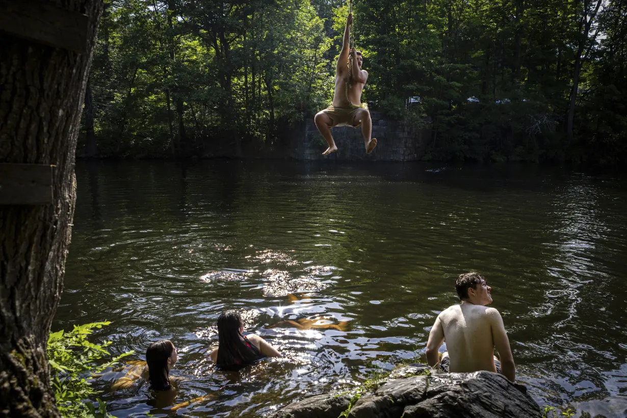 As millions sweat out the heat wave, blocks of lake ice keep these campers cool