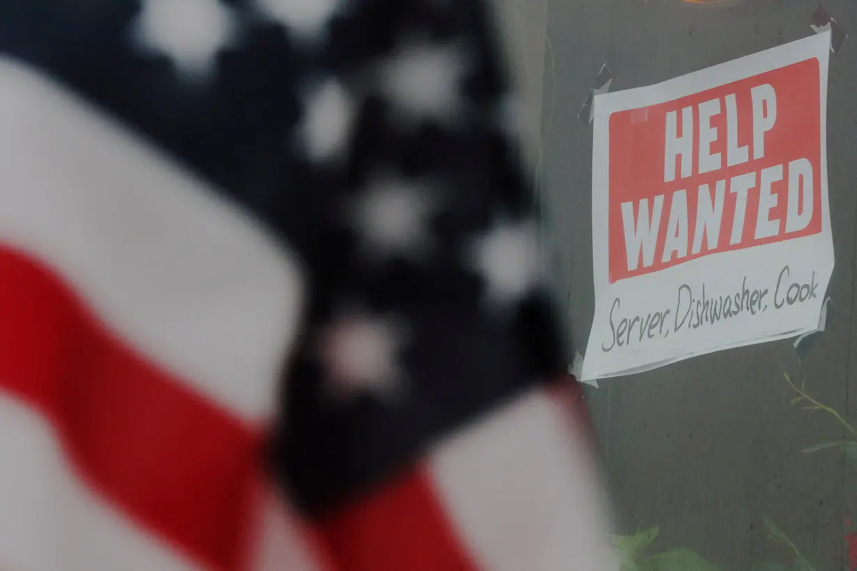 FILE PHOTO: A “Help Wanted” sign hangs in restaurant window in Medford