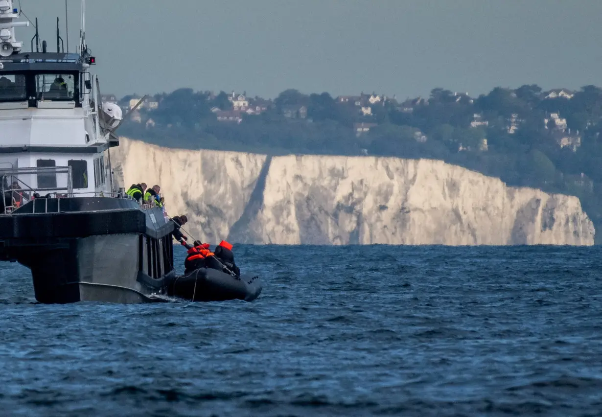 FILE PHOTO: Migrants cross the English Channel in small boats