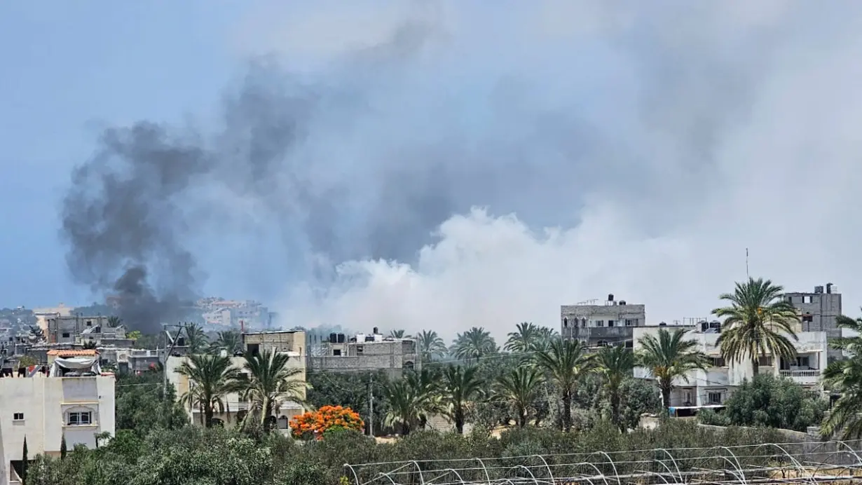 Smoke rises during an Israeli air strike, in central Gaza Strip