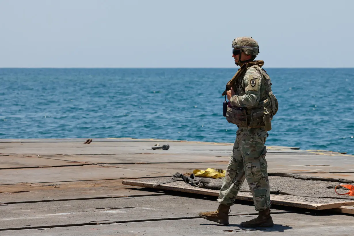 Soldiers stand at Trident Pier