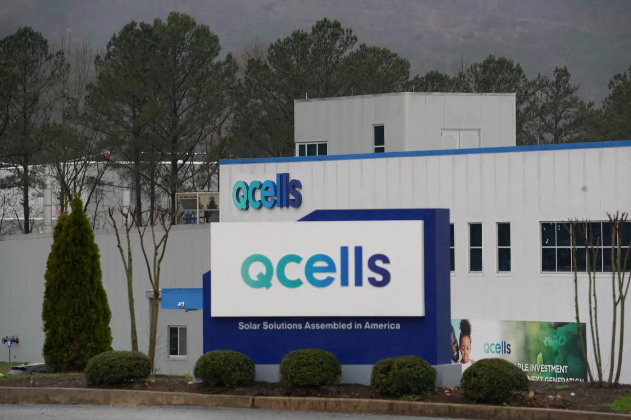 FILE PHOTO: The logo of QCells is seen at the QCells solar energy manufacturing factory in Dalton