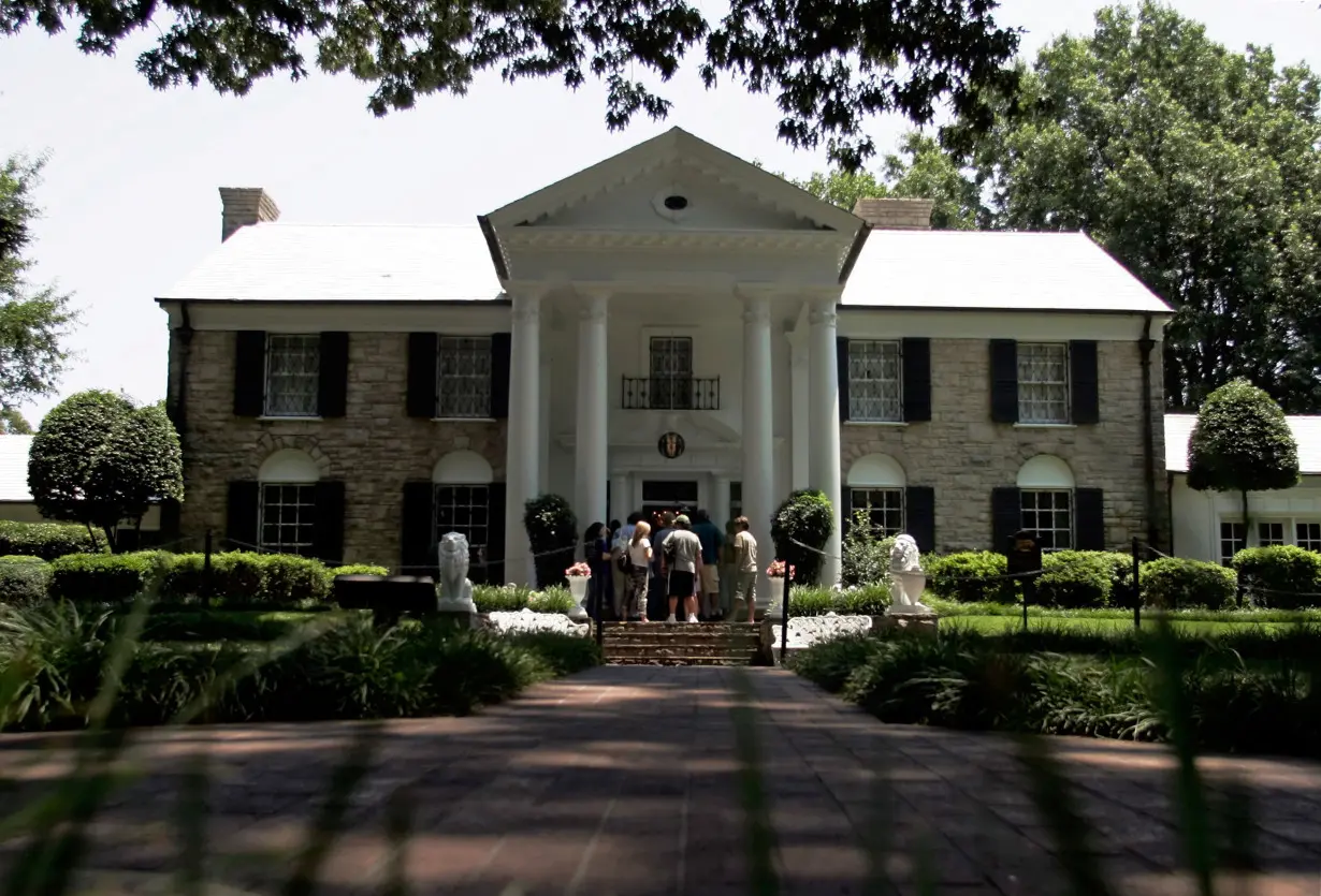 FILE PHOTO: Tourist enter Graceland mansion in Memphis