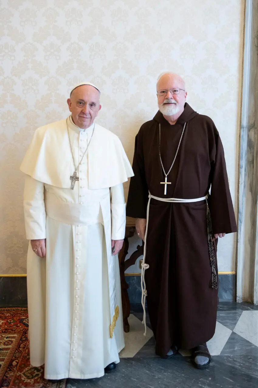 FILE PHOTO: Pope Francis poses with Cardinal Sean Patrick O'Malley during a private audience at the Vatican