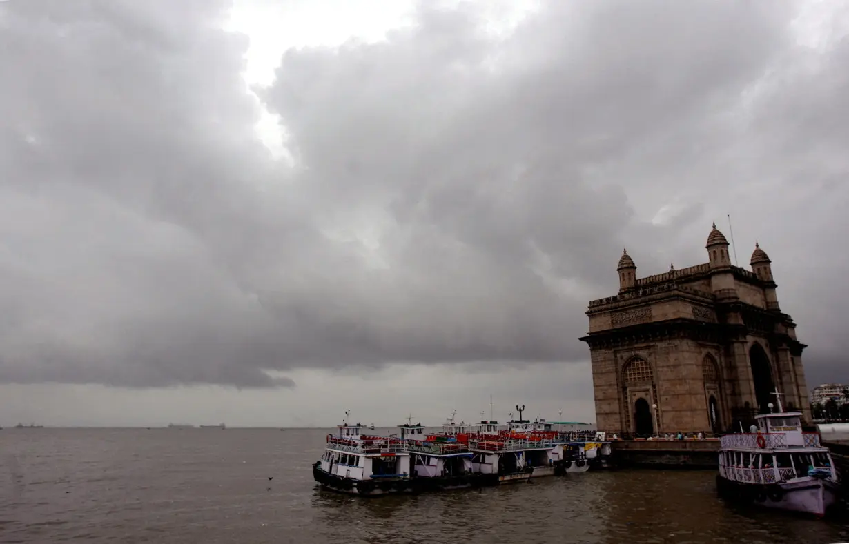 FILE PHOTO: Monsoon clouds gather over the Gateway of India in Mumbai