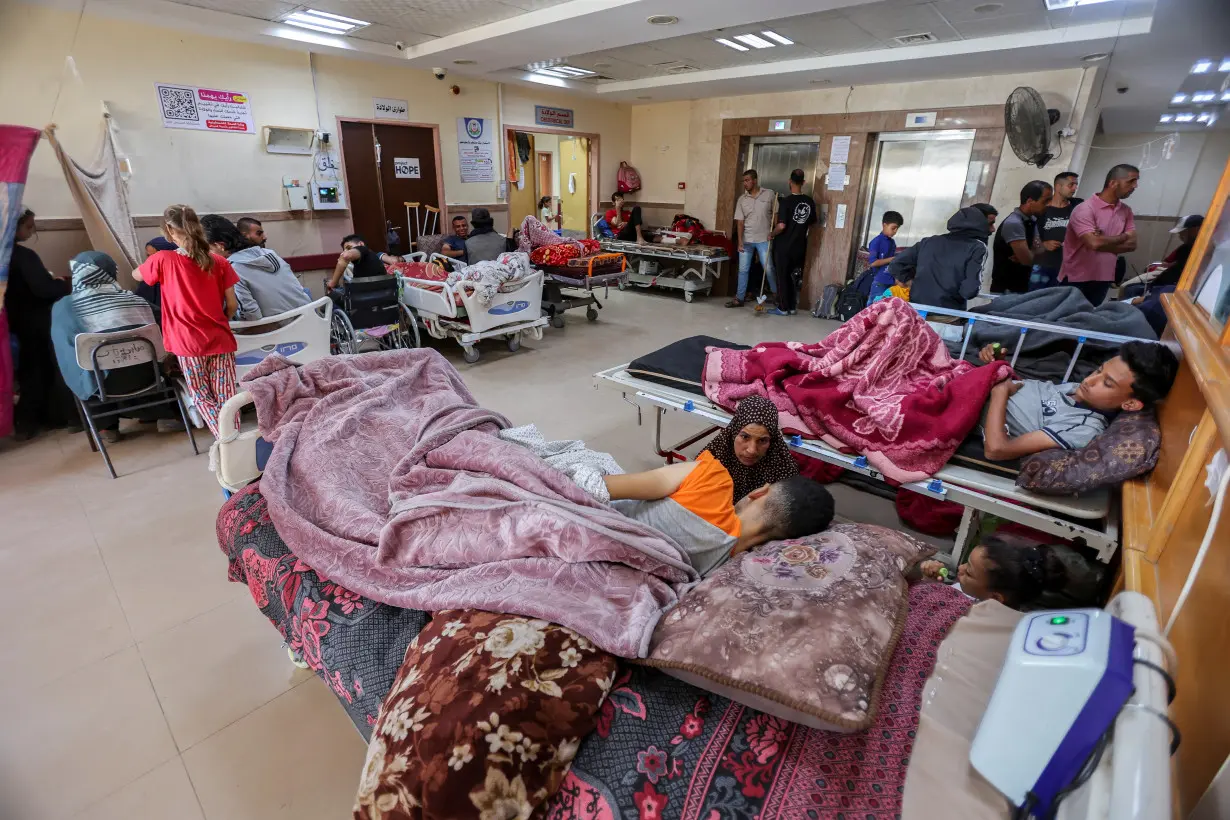 FILE PHOTO: Palestinians wounded in Israeli fire lie on beds as they receive treatment at Al-Aqsa hospital in Deir Al-Balah in the central Gaza Strip