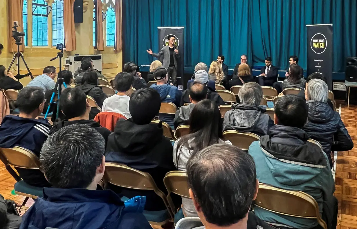 People participate in a hustings event focussed on the Hong Kong community, in Sutton