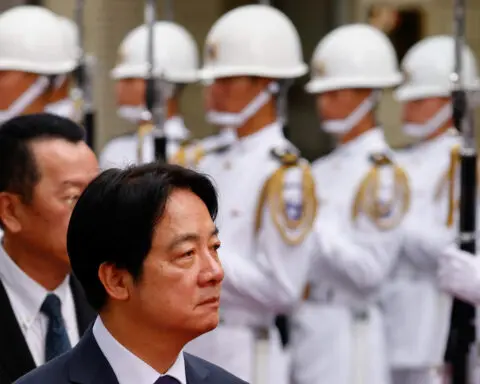 Taiwan president says only military strength can keep the peace with China