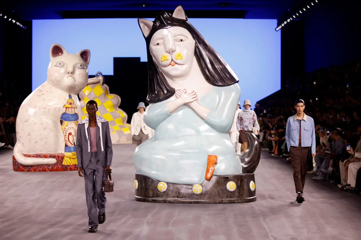 Giant cats stalk the catwalk at the Dior men's show