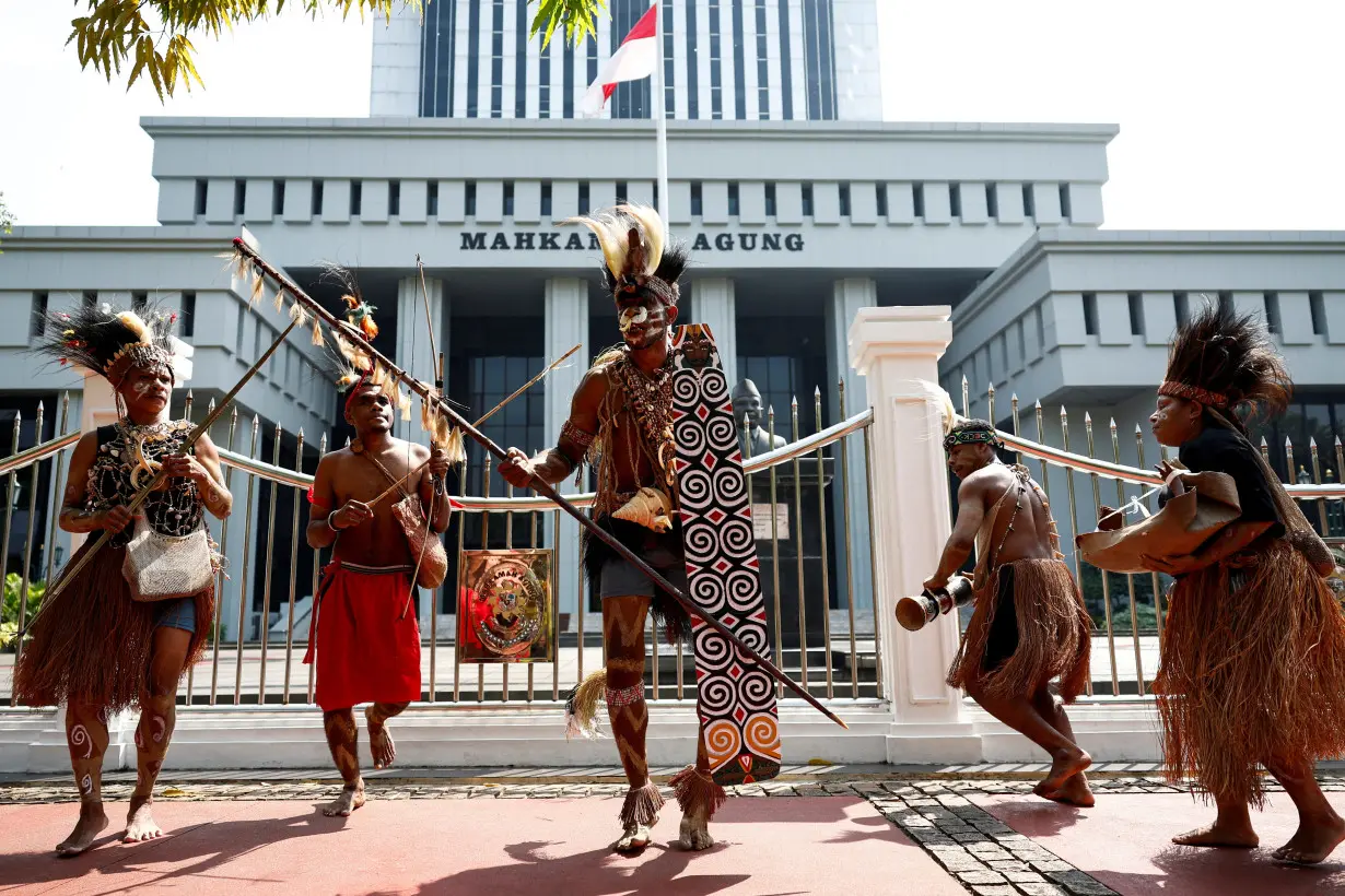 FILE PHOTO: Protest against deforestation in indigenous Papuans' land, outside the country's Supreme Court in Jakarta