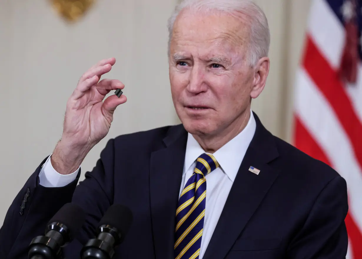 U.S. President Biden signs an executive order on the economy at the White House in Washington