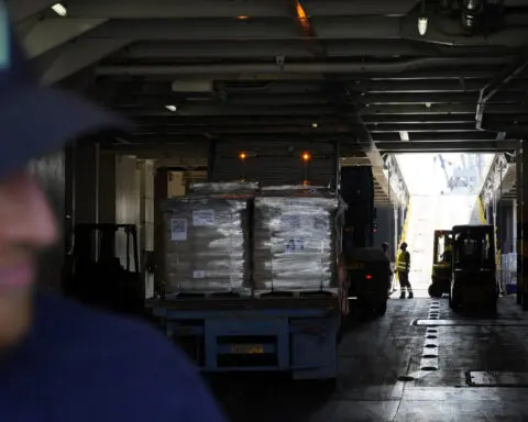 Gunfire, lawlessness and gang-like looters are preventing aid distribution in Gaza, an official says