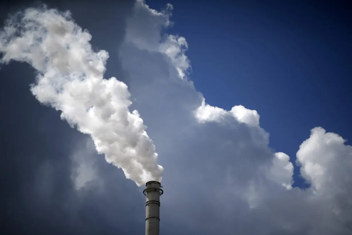 FILE PHOTO: Steam is released from a petroleum refinery in Sulphur, Louisiana,