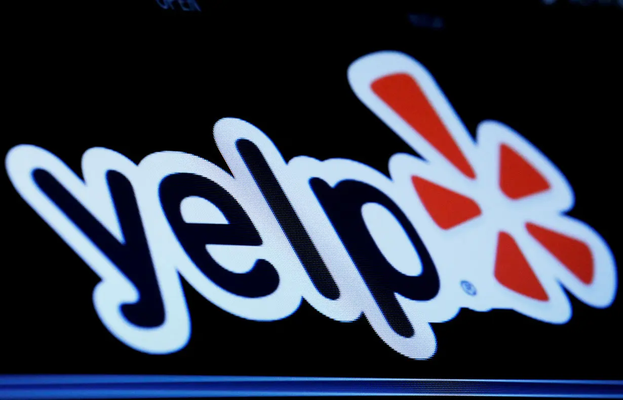 FILE PHOTO: The company logo for Yelp! is displayed on a screen on the floor of the NYSE