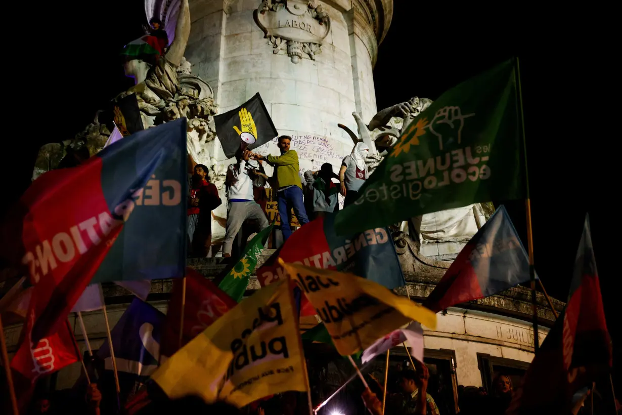 People gather on the Place de Republique following the results of the European elections, in Paris