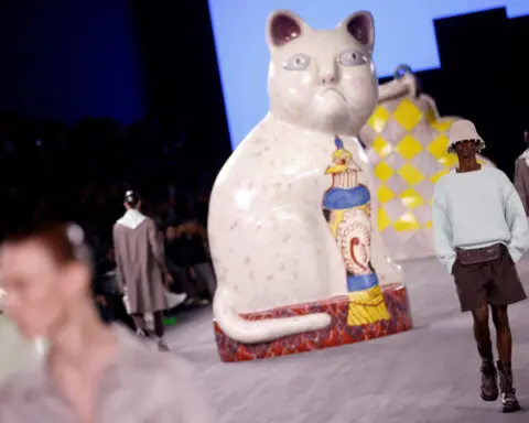 Giant cats stalk the catwalk at the Dior men's show