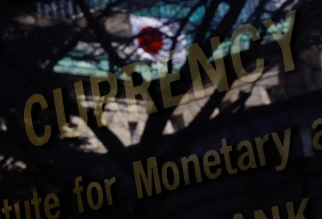 Japanese national flag is reflected on the Currency Museum of the Bank of Japan in Tokyo