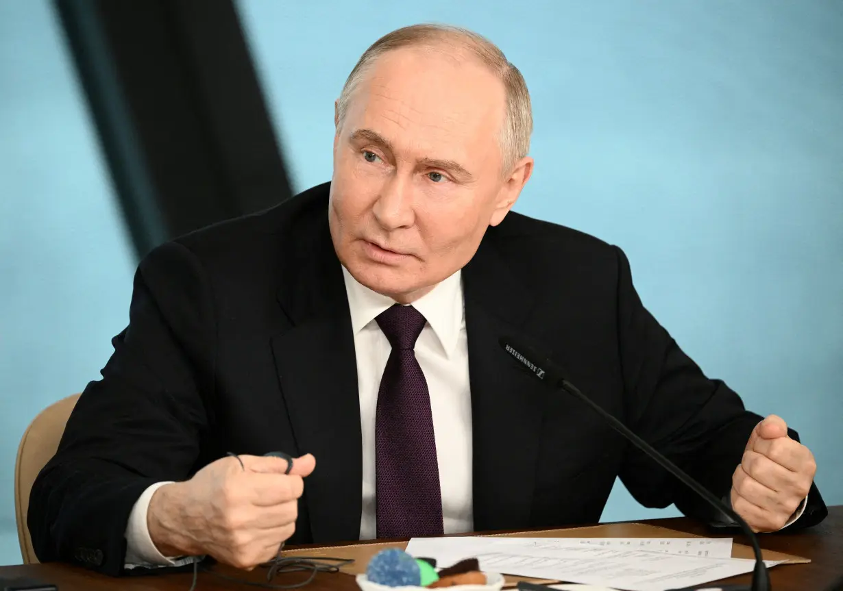 FILE PHOTO: Russian President Putin meets international news agency editors in St Petersburg