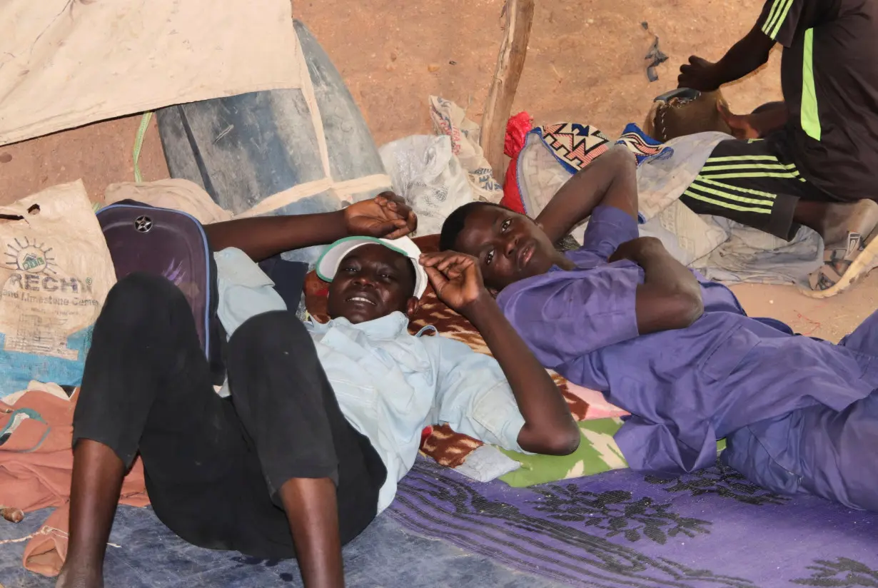 Migrants wait for their departure to Libya in Agadez