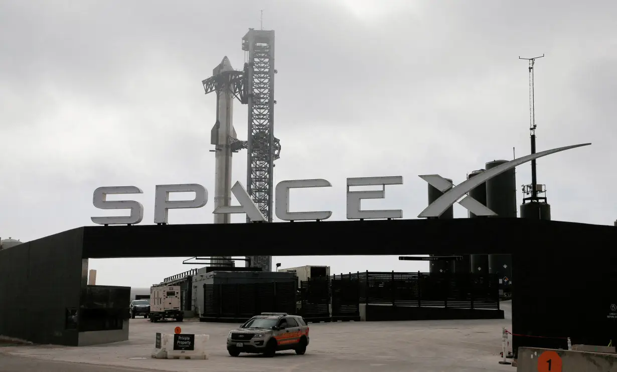 FILE PHOTO: SpaceX's next-generation Starship spacecraft atop its powerful Super Heavy rocket is prepared for launch