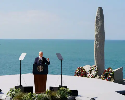 Biden asks Americans to recommit to democracy in Normandy cliff speech