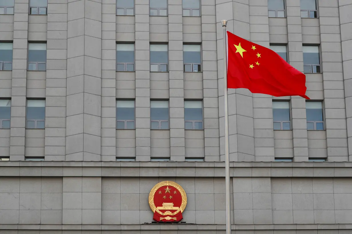 A Chinese national flag waves outside Beijing No. 2 Intermediate People's Court where Australian writer Yang Hengjun is expected to face trial on espionage charges, in Beijing