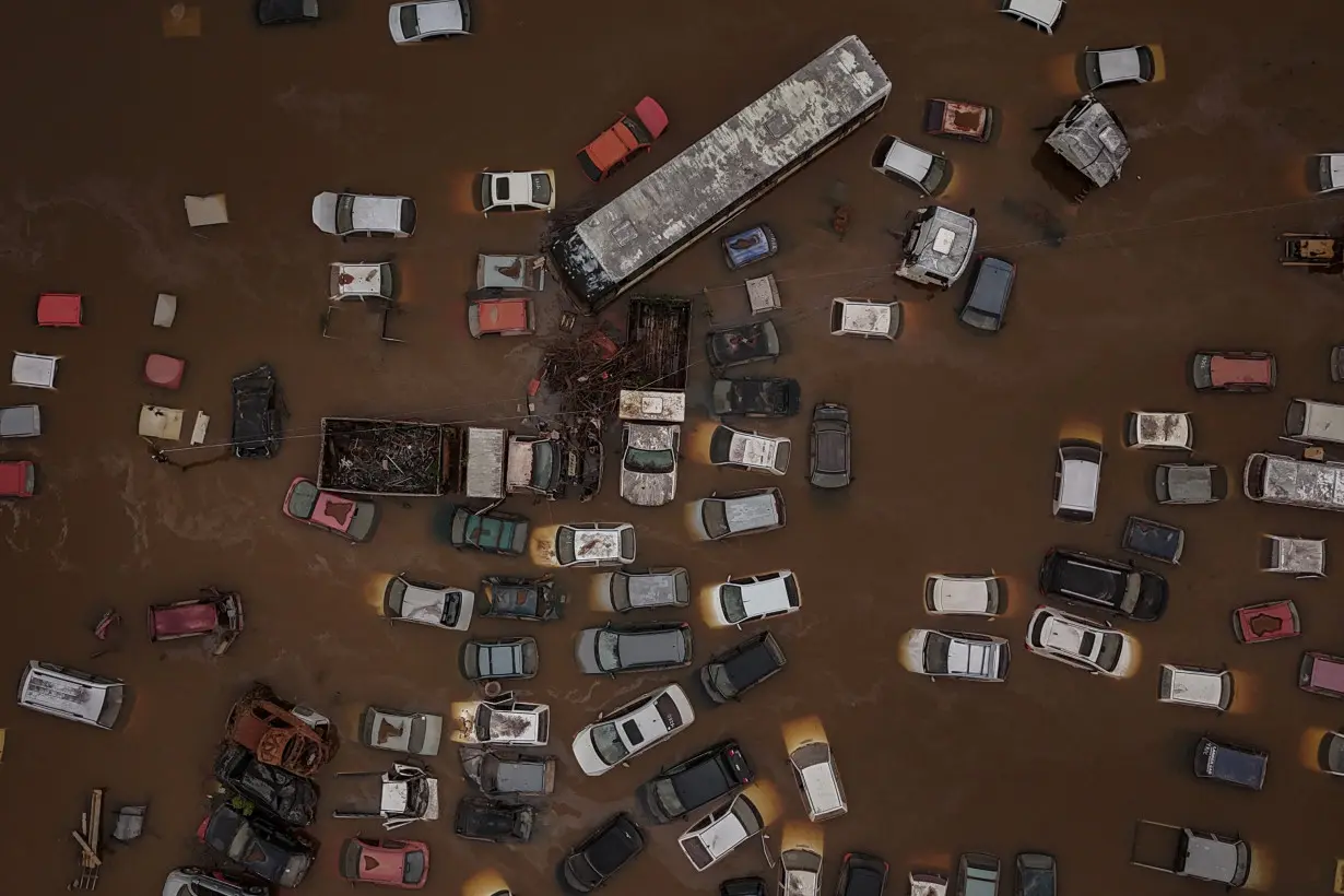 The Wider Image: Flood-battered farmers in southern Brazil wade through lost harvests