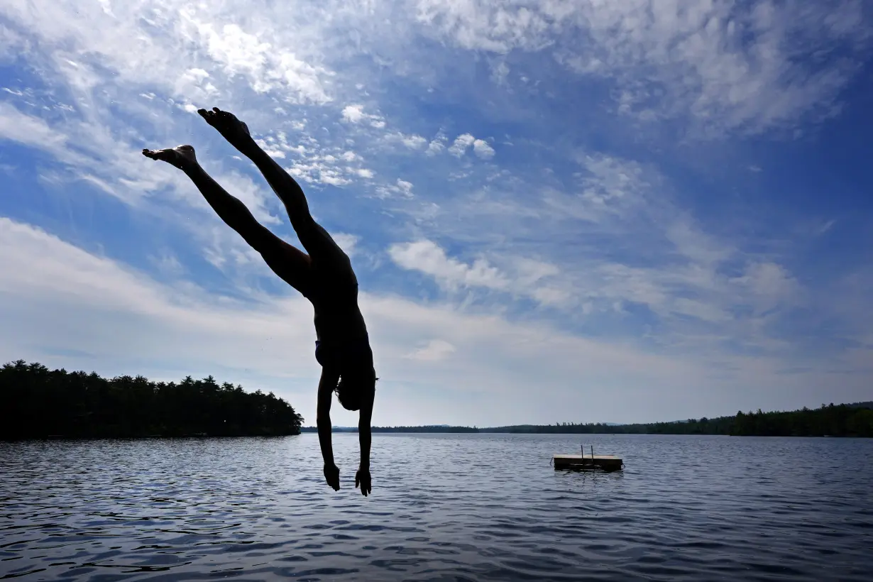 As millions sweat out the heat wave, blocks of lake ice keep these campers cool