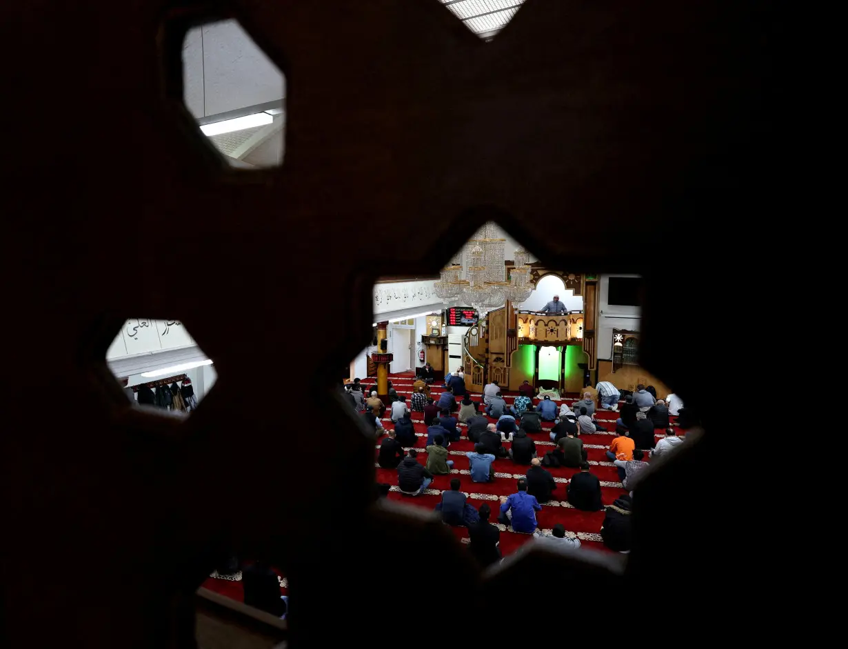 FILE PHOTO: Muslims attend Friday prayers in Berlin