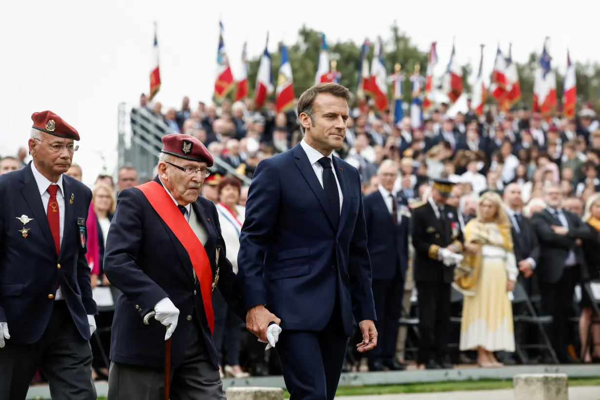 Macron pays tribute to civilian victims of D-Day bombings in Normandy