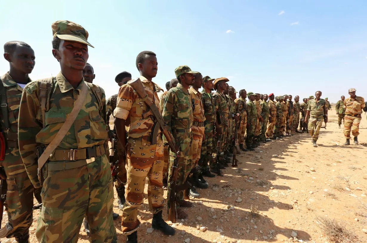 FILE PHOTO: Ethiopian and Somali government soldiers line-up before embarking on a joint patrol in areas south east of Dusamareeb