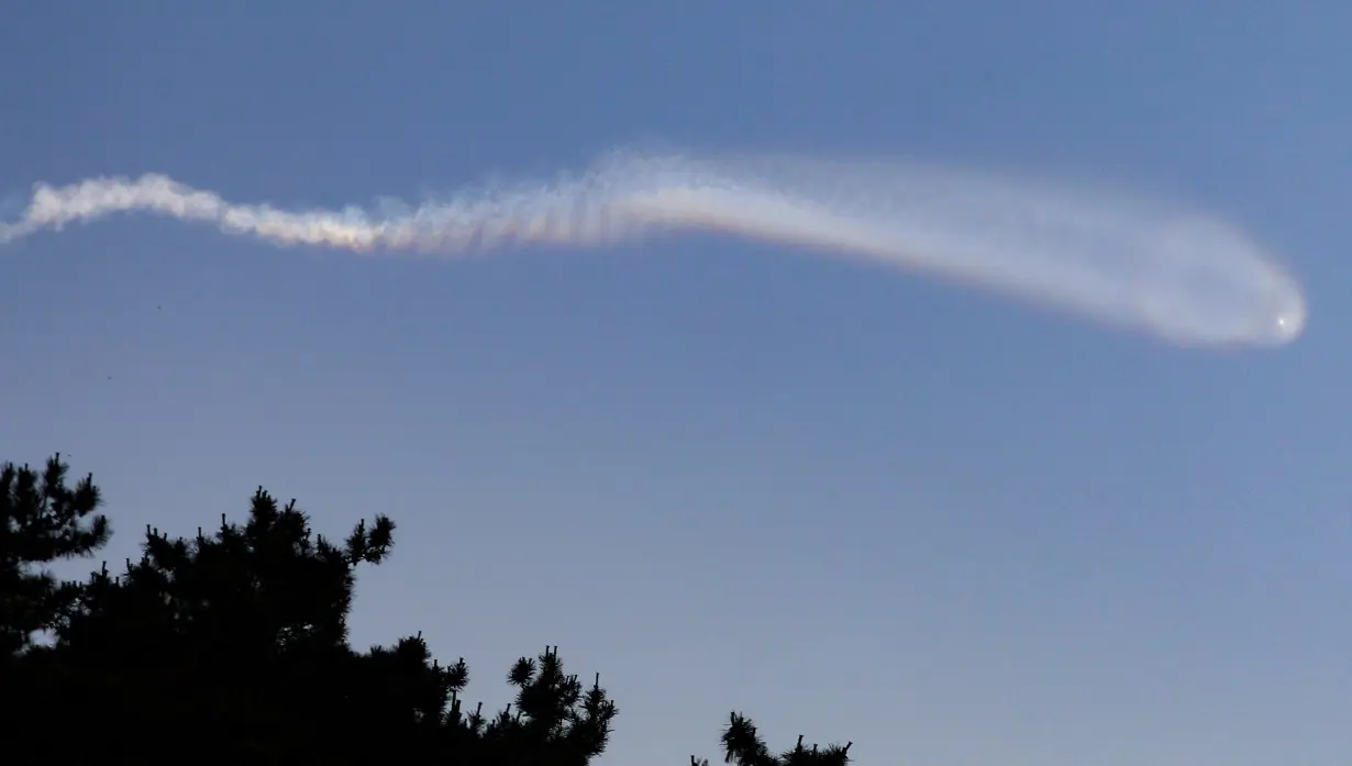 The contrail of North Korean missile is pictured from Yeonpyeong Island