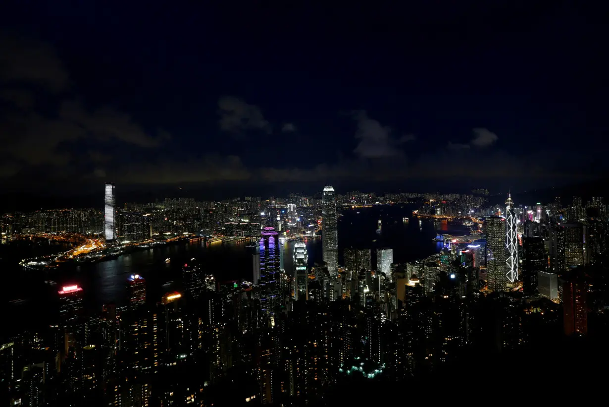 FILE PHOTO: Lights light up the skyline of Hong Kong in the evening