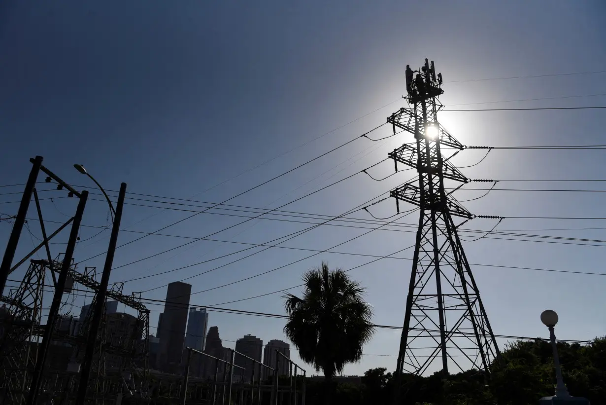 FILE PHOTO: People react to a period of hot weather in Houston