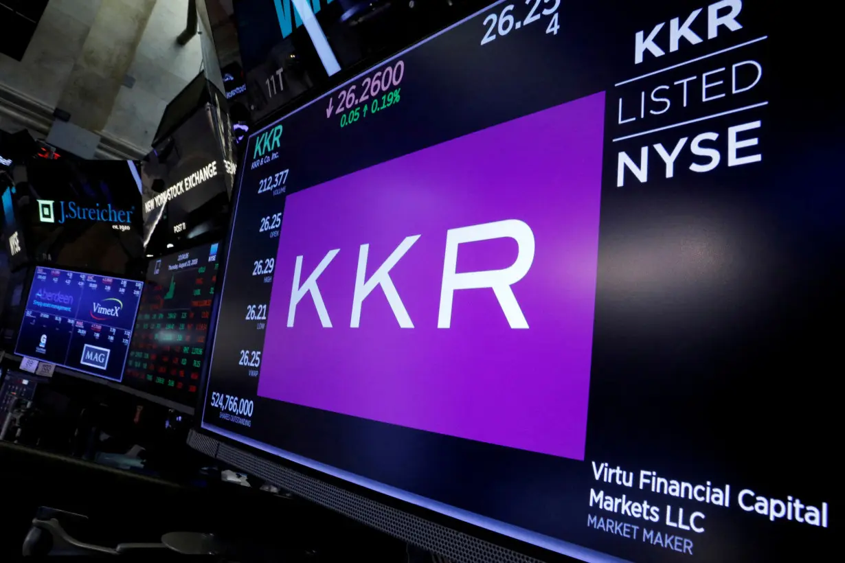 FILE PHOTO: Trading information for KKR & Co is displayed on a screen on the floor of the NYSE in New York