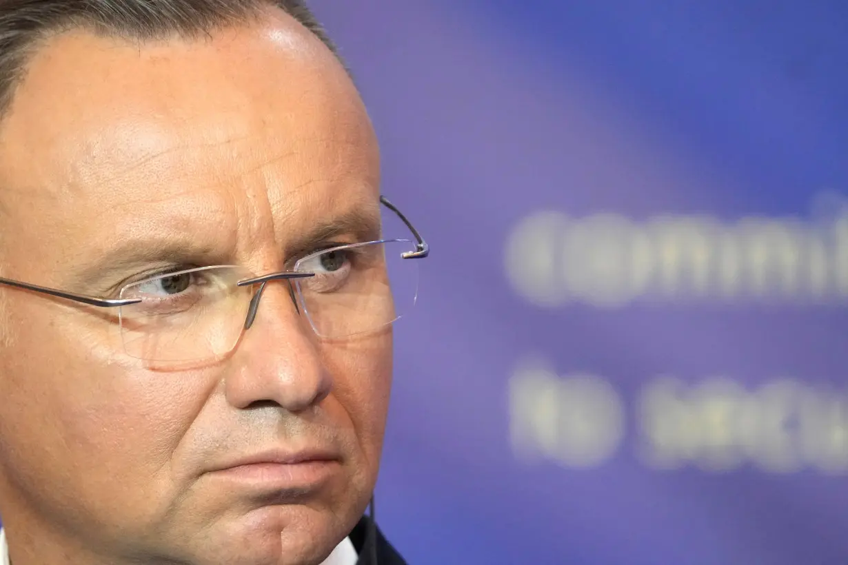 FILE PHOTO: Poland's President Andrzej Duda listens during a press conference in Riga